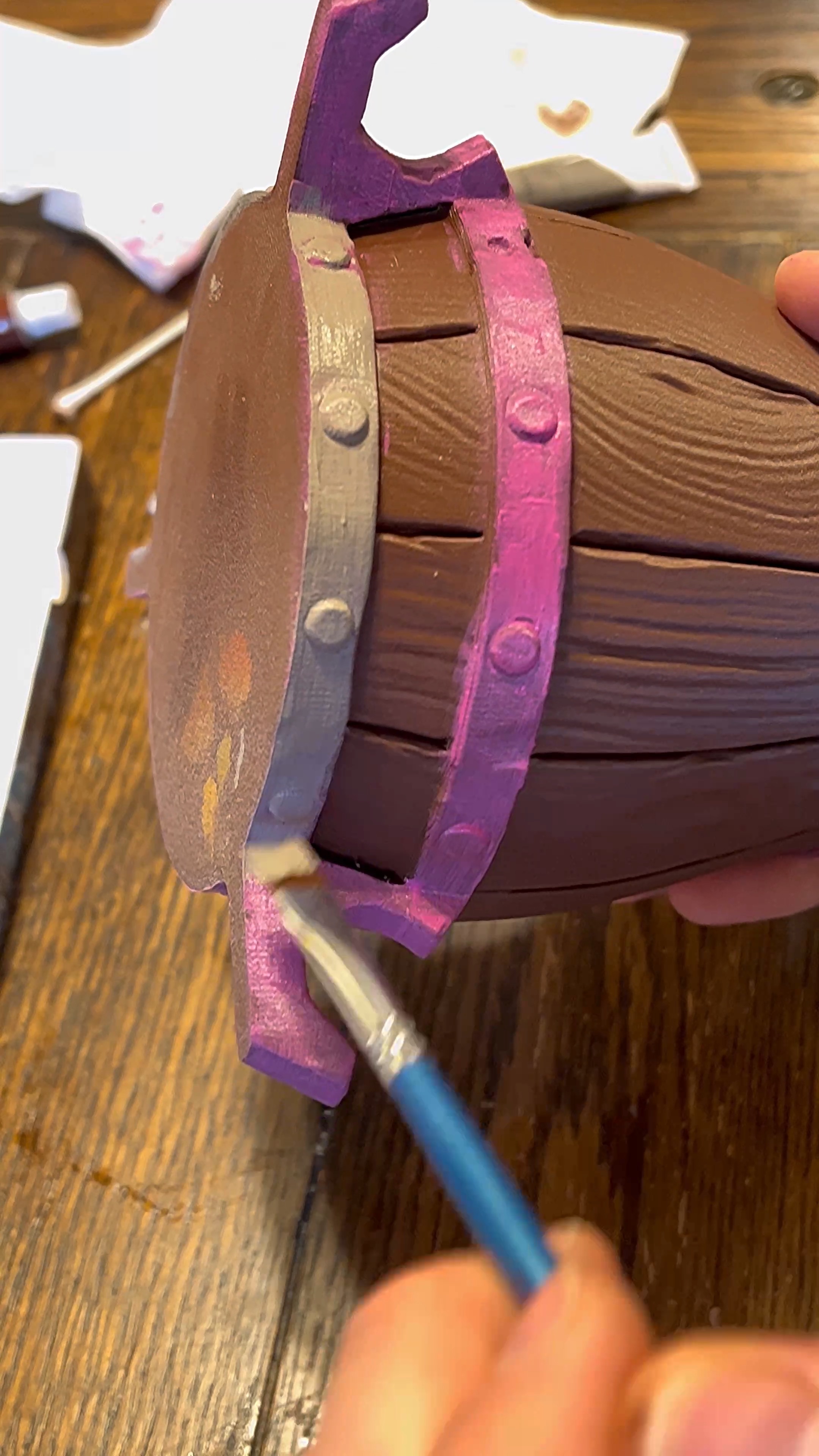 Painting a coat of grey over the pink primer.